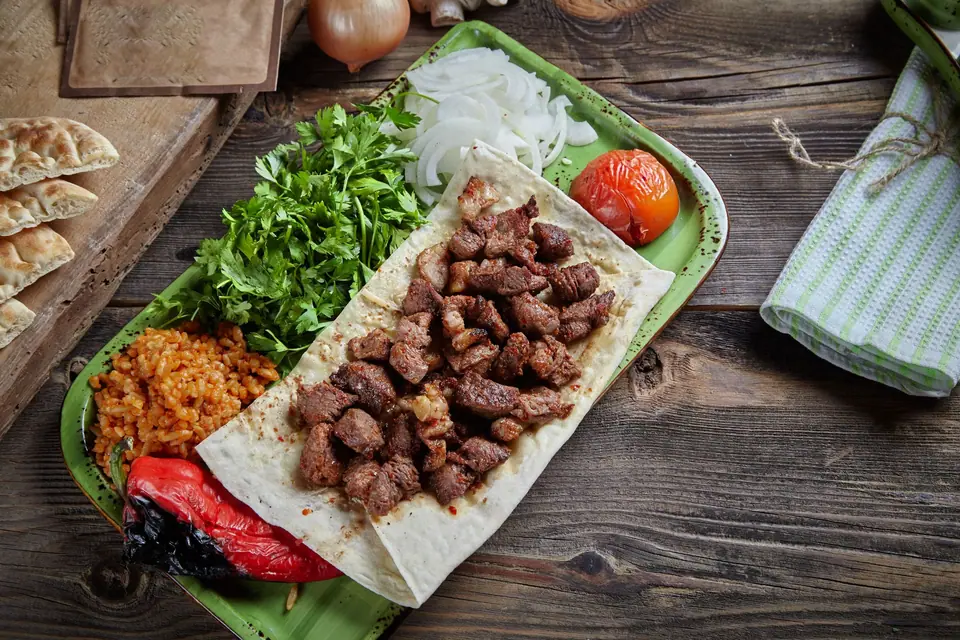 Tray of Meat with Rice, Vegetables and a Flatbread