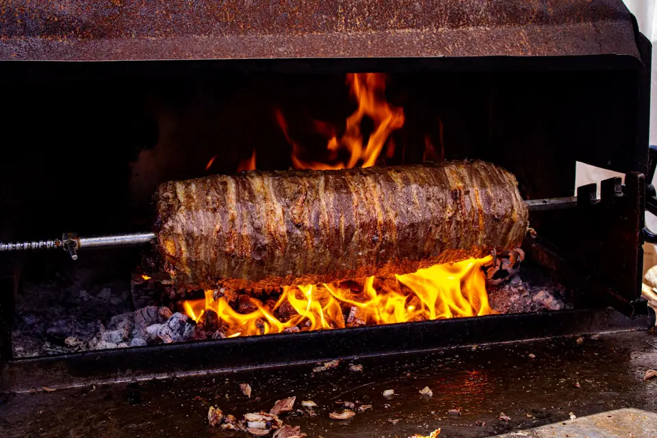 Traditional Turkish Doner Kebab Cooking Over Flames