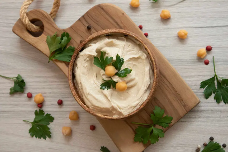 Delicious Homemade Hummus on Cutting Board