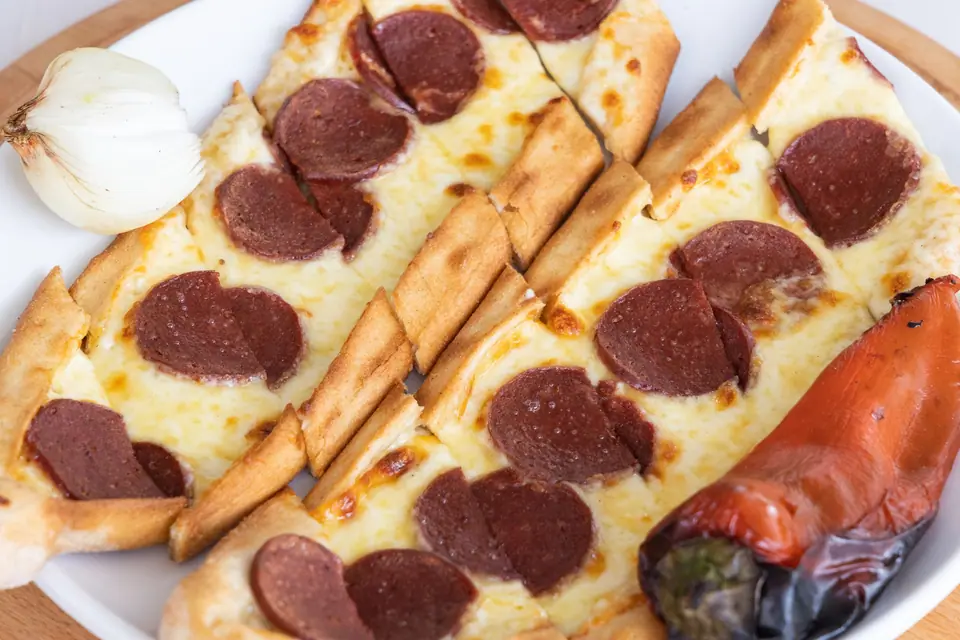 Bread with Cheese and Meat Slices Beside the Roasted Chili Pepper
