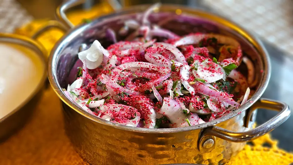 Fresh Onion Salad with Citrus Garnish in Copper Bowl